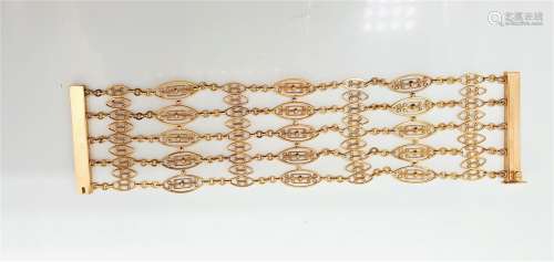 Bracelet en or jaune 18k (750 millièmes) formé de 5 rangs de...