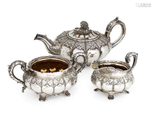 A George IV three piece silver tea set, London, c.1824 and 1...