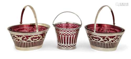 Three Victorian silver sweetmeat baskets with red glass line...