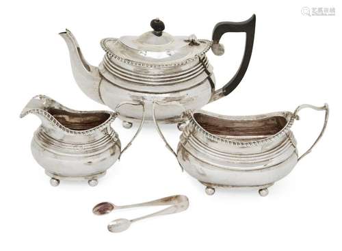 A matched silver three piece tea set by George Nathan & ...