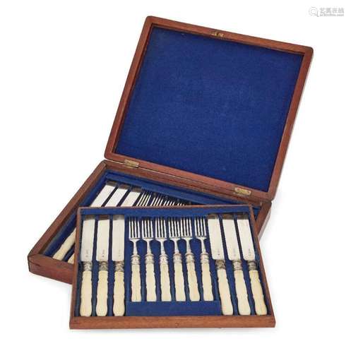 A cased set of Edwardian silver dessert knives and forks, Lo...