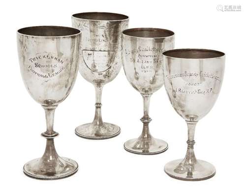 A group of four silver trophy cups, various marks including ...