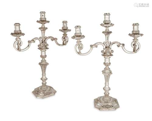 A pair of Asprey & Co. silver three light candelabra, Lo...