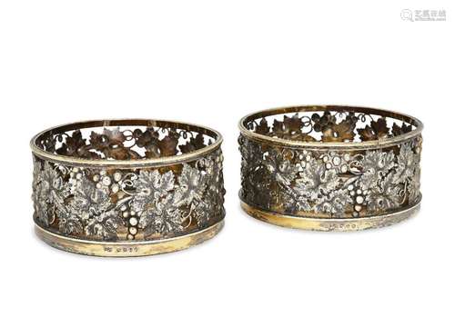 A pair of George III silver gilt wine coasters, London, c.18...