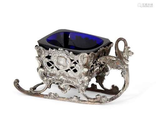 A silver salt designed as a sleigh, with blue glass liner su...