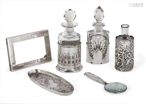 Two silver mounted vanity bottles, the first Birmingham, c.1...