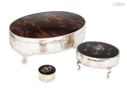 Two silver and tortoiseshell dressing table boxes and a silv...