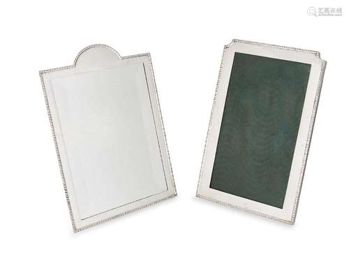 A matched silver mounted mirror and photo frame, both of sha...