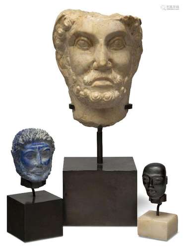 A modern marble bust of a man, after the antique, on metal s...