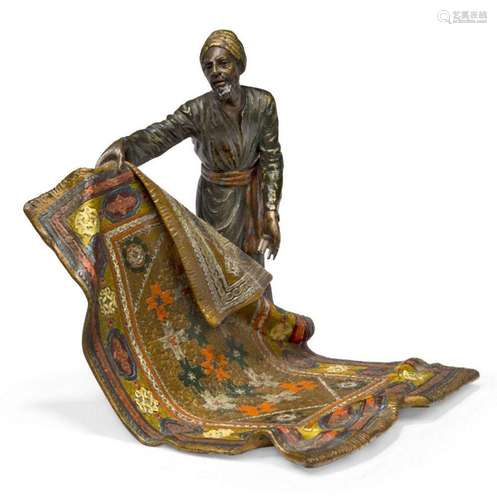 An Austrian cold-painted bronze model of a carpet seller, in...