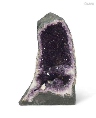 An amethyst and quartz 'cathedral' geode specimen,...