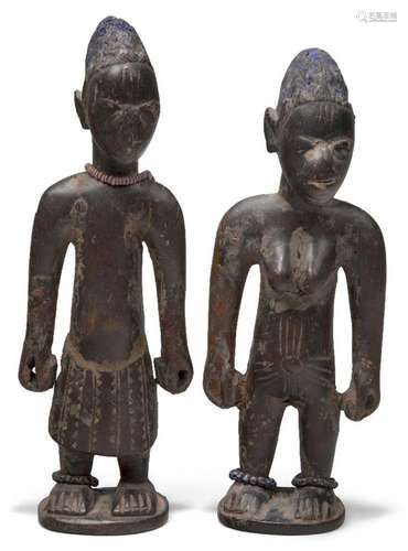 A pair of Yoruba male and female 'Ibeji' figures, ...