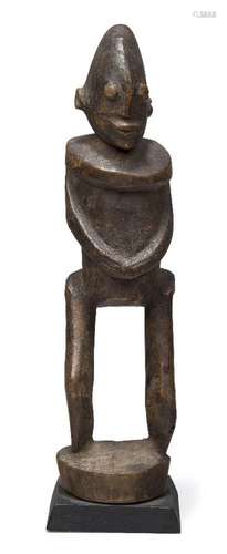 A Dogon figure, Mali, 20th century, of stylised form, carved...