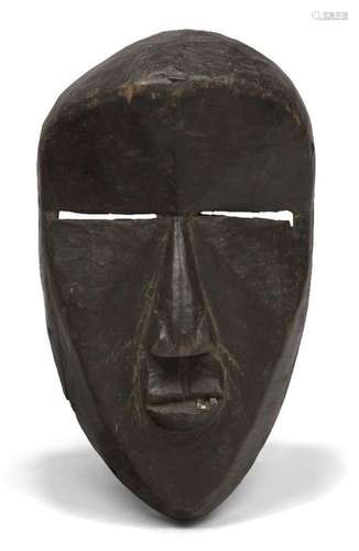 A Dan mask, Ivory Coast, 20th century, of oval form with car...