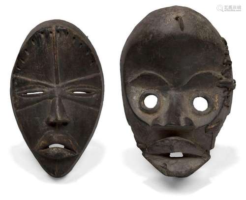 A Dan mask, Ivory Coast, 20th Century, of oval form with car...