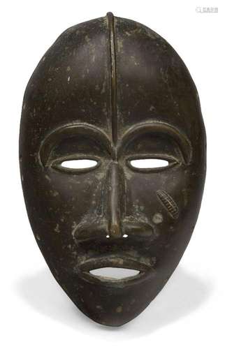 A Dan bronze mask, Ivory Coast, 20th century, of oval form w...