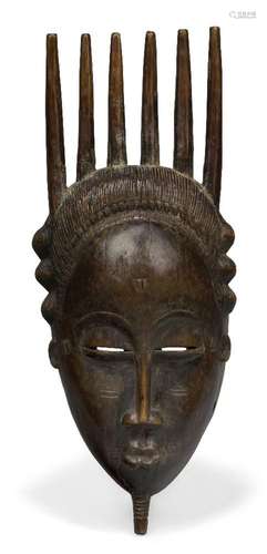 A Yaure mask, Ivory Coast, 20th century, with comb of vertic...