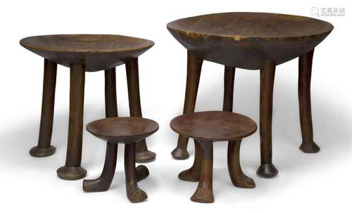 Two Karamojong hardwood tripod stools, Uganda, 20th century,...