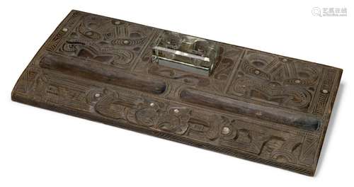 A MÄori carved wood desk stand, early 20th century, carved ...