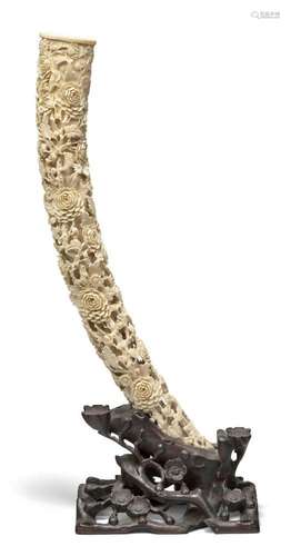 A Chinese carved ivory tusk, late 19th century, densely carv...