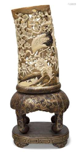 A Japanese carved and lacquered ivory trunk vase, Meiji Peri...