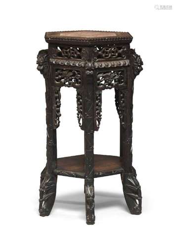 A Chinese hardwood carved jardiniere stand, 20th century, of...