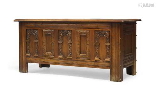 A Jacobean style oak coffer, the lid enclosing storage area,...