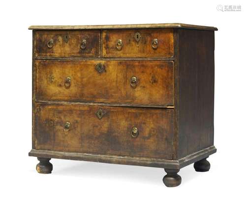 A George I walnut and laburnum chest of drawers, c.1720, the...