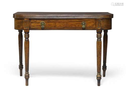 A George III mahogany fold-over tea table, c.1820, the round...