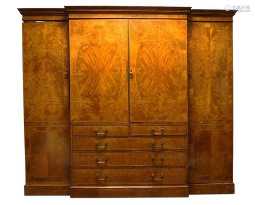 A flame mahogany breakfront linen press, 19th century, the c...