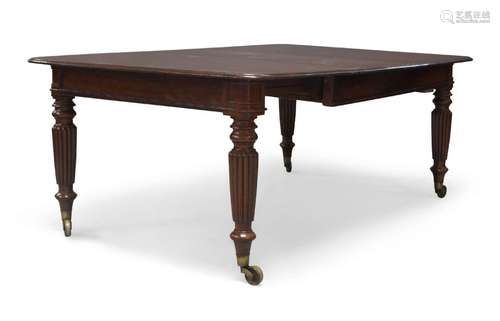 A Victorian mahogany extending dining table, fitted with thr...