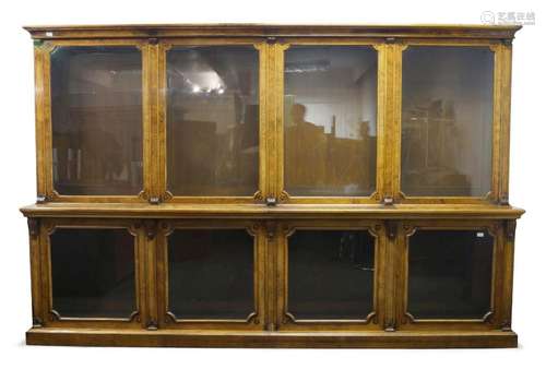 A large mid Victorian four sectioned walnut glazed bookcase,...