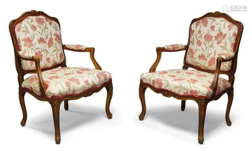 A pair of Louis XV style fruitwood armchairs, 20th century, ...