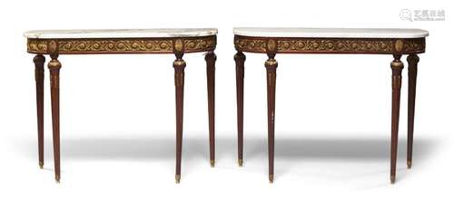 A pair of Louis XVI style mahogany marble topped console tab...