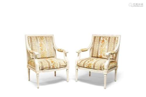 A pair of French white painted open armchairs, of recent man...