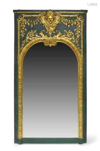 A Continental green painted and parcel gilt wall mirror, in ...