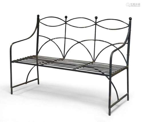 A black-painted wrought-iron garden bench, late 20th century...