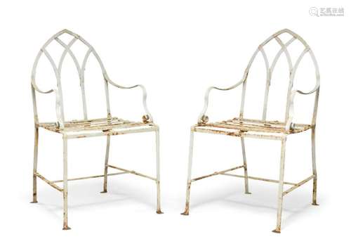 A pair of white-painted wrought-iron garden chairs, mid 20th...