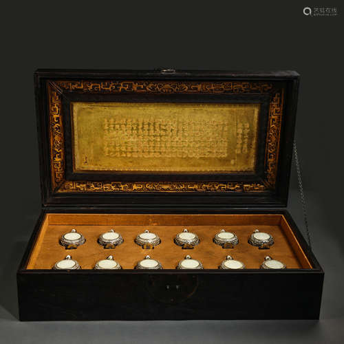 A SET OF SILVER ZODIAC INLAID HETIAN JADE IN THE PALACE OF Q...