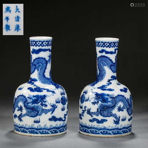 A PAIR OF BLUE-AND-WHITE DRAGON-SHAPED LONG-NECKED VASES IN ...