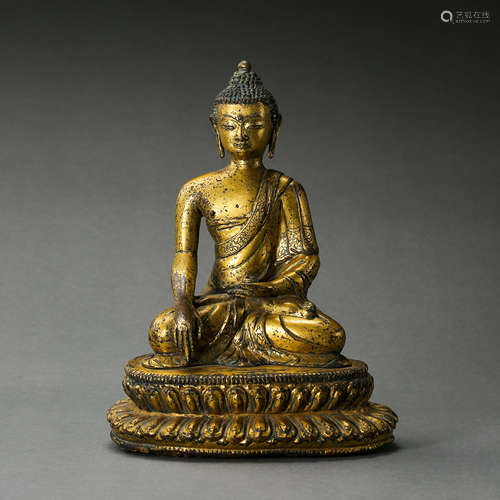 A GILT BRONZE STATUE OF SAKYAMUNI BUDDHA, YUAN DYNASTY, CHIN...