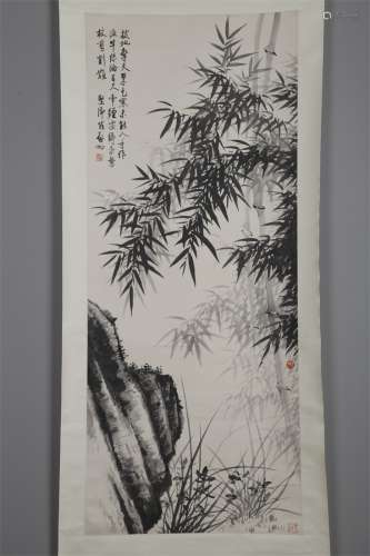 A Bamboo Orchid and Rock Painting by Qi Gong.