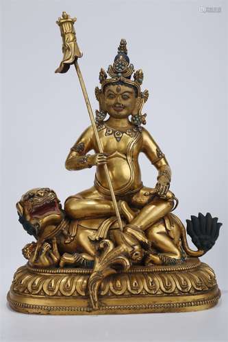 A Gilt Copper Vaisravana Buddha Statue.