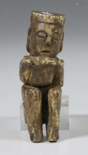 Borneo, Kalimantan, seated bone figure