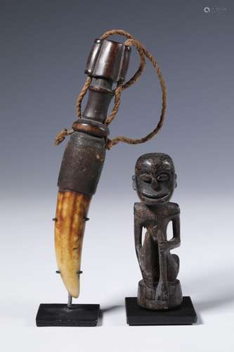 Timor, powder horn and an East Kalimantan, Dayak amulet.