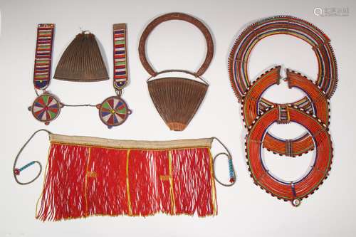 Kenya, Kirdi, three beaded necklaces, one beaded belt and tw...