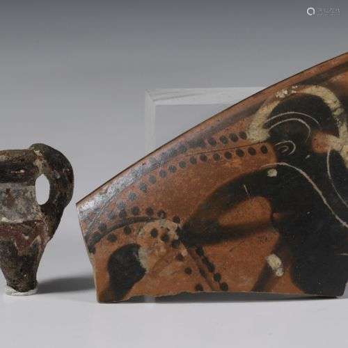 Roman, glass amphora amulet, 2nd century and a Greek terraco...