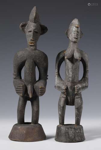 Ivory Coast, Senufo, a standing male and female figure,