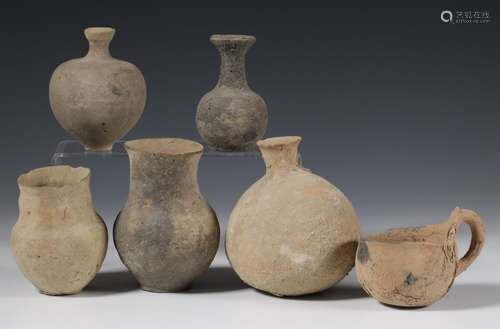 A collection of six antique terracotta pots and a jug of Rom...