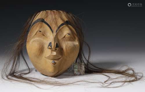 Victor Reece (born 1946), a carved face mask in Tsimshian st...